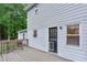 Wooden deck attached to the home featuring a doggie door and backyard views at 5083 Lambeth Nw Ct, Acworth, GA 30101