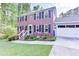 Two-story brick home with a two-car garage, black shutters, and a well-maintained lawn at 5083 Lambeth Nw Ct, Acworth, GA 30101