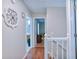 Hallway with hardwood floors that shows access to the upstairs living areas at 5083 Lambeth Nw Ct, Acworth, GA 30101