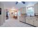 Open kitchen layout with white cabinets, stainless steel appliances, and adjacent dining area at 5083 Lambeth Nw Ct, Acworth, GA 30101
