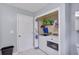 A laundry area tucked away in a closet with a washer and dryer and storage shelves at 5083 Lambeth Nw Ct, Acworth, GA 30101