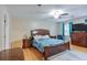 Spacious main bedroom with a ceiling fan, wood floors, and a light blue color scheme at 5083 Lambeth Nw Ct, Acworth, GA 30101