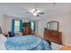Light and airy main bedroom featuring wood floors, ceiling fan and plenty of natural light at 5083 Lambeth Nw Ct, Acworth, GA 30101