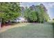 Overhead view of fenced backyard with well-manicured lawn surrounding the house and deck at 5083 Lambeth Nw Ct, Acworth, GA 30101