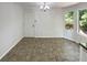 Bright Dining area with tile floor and natural light streaming through the window at 5537 Panola Pl, Lithonia, GA 30058
