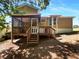 Backyard view of home with screened porch and deck at 5537 Panola Pl, Lithonia, GA 30058