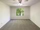 Spacious bedroom with a large window providing ample natural light at 5537 Panola Pl, Lithonia, GA 30058