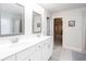 Bright bathroom features a double sink vanity and a glass enclosed shower with an inset bathtub at 637 Little Bear Loop, Canton, GA 30114