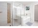 Well-lit bathroom featuring a bathtub, glass shower, and tiled floors at 637 Little Bear Loop, Canton, GA 30114