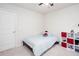 Comfortable bedroom with a built-in bookcase and neutral-toned walls and carpet at 637 Little Bear Loop, Canton, GA 30114