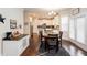 Bright dining area with hardwood floors adjacent to the kitchen at 637 Little Bear Loop, Canton, GA 30114