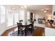 Cozy dining area featuring hardwood floors and a view into the spacious living room at 637 Little Bear Loop, Canton, GA 30114