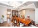 Stylish dining room boasts coffered ceiling, hardwood floors, and a view into the gourmet kitchen at 637 Little Bear Loop, Canton, GA 30114