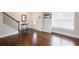 Welcoming entryway with dark wood flooring, stairs, and coat storage at 637 Little Bear Loop, Canton, GA 30114