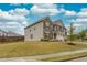 Charming two-story home with stone and siding exterior and well-manicured lawn at 637 Little Bear Loop, Canton, GA 30114