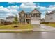 Charming two-story home with stone and siding exterior, complemented by a landscaped front yard at 637 Little Bear Loop, Canton, GA 30114