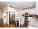 Modern kitchen with stainless steel appliances, granite countertops, and a stylish island for food prep at 637 Little Bear Loop, Canton, GA 30114