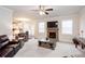 Bright living room with a stone fireplace, open layout, and seamless dining area access at 637 Little Bear Loop, Canton, GA 30114
