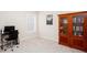 Office area with a desk, chair, window, and wooden cabinet at 637 Little Bear Loop, Canton, GA 30114