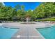 Community splash pad with fountains and lounge seating, perfect for Gathering fun on a sunny day at 637 Little Bear Loop, Canton, GA 30114