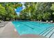 Well-maintained community swimming pool with clear blue water and plenty of seating for relaxation at 637 Little Bear Loop, Canton, GA 30114