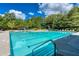 Inviting community pool area with a waterslide and plenty of lounge chairs, perfect for relaxation at 637 Little Bear Loop, Canton, GA 30114