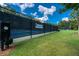 Manicured lawn and landscaping bordering tennis courts, enhancing the community's appeal with well-maintained recreational facilities at 637 Little Bear Loop, Canton, GA 30114