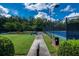 Landscaped path leading to the community tennis courts, providing an accessible and inviting space for sports activities at 637 Little Bear Loop, Canton, GA 30114