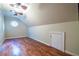 Attic space featuring hardwood floors, recessed lighting, and a unique round window at 655 Moreland Se Ave, Atlanta, GA 30316