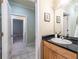 Bathroom view showcasing vanity with granite countertop and mirror at 655 Moreland Se Ave, Atlanta, GA 30316