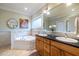 Bright bathroom with dual sinks, and a large mirror at 655 Moreland Se Ave, Atlanta, GA 30316