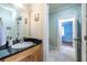 Bathroom view showcasing vanity with granite countertop and mirror at 655 Moreland Se Ave, Atlanta, GA 30316