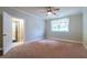 Bright bedroom featuring a ceiling fan, neutral walls, and a window for natural light at 655 Moreland Se Ave, Atlanta, GA 30316
