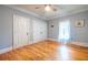 Well-lit bedroom highlighting gleaming hardwood floors, crown molding, and neutral wall color at 655 Moreland Se Ave, Atlanta, GA 30316