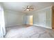 Spacious bedroom with neutral carpet, complemented by bright natural light from large window at 655 Moreland Se Ave, Atlanta, GA 30316