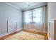 Cozy bedroom with hardwood floors, window with curtains, and built-in storage at 655 Moreland Se Ave, Atlanta, GA 30316