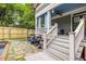 Beautiful exterior with stairs leading to porch, stone path to the pool, and fresh landscaping at 655 Moreland Se Ave, Atlanta, GA 30316