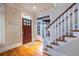 Inviting foyer features a stained glass window above the wood door and hardwood floors at 655 Moreland Se Ave, Atlanta, GA 30316