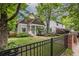 Beautifully landscaped front yard with a charming craftsman-style home in the background at 655 Moreland Se Ave, Atlanta, GA 30316