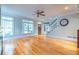 Open concept living room with hardwood floors, a ceiling fan and staircase at 655 Moreland Se Ave, Atlanta, GA 30316