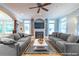 The staged living room has a fireplace, hardwood floors, and natural light at 655 Moreland Se Ave, Atlanta, GA 30316