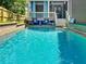 Relaxing backyard pool area with a charming porch, perfect for summer days at 655 Moreland Se Ave, Atlanta, GA 30316