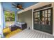 Relaxing porch with seating, blue ceiling, and convenient access to the home's interior at 655 Moreland Se Ave, Atlanta, GA 30316