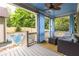 Inviting porch with wicker furniture, curtains, and adjacent private pool at 655 Moreland Se Ave, Atlanta, GA 30316