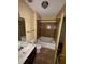 Bathroom with a tile shower, soaking tub, toilet, and vanity with sink at 898 Oak St # 3412, Atlanta, GA 30310
