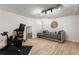 Bright room with wood floor, daybed, workout equipment and accent mirror at 1420 Defoors Nw Dr, Atlanta, GA 30318