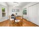 Charming dining area featuring hardwood floors, stylish lighting, and built-in bar for entertaining at 1420 Defoors Nw Dr, Atlanta, GA 30318