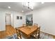 Dining room featuring hardwood floors, wooden table, and view of living room at 1420 Defoors Nw Dr, Atlanta, GA 30318