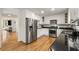 Kitchen featuring stainless appliances, white cabinets, hardwood floors and granite countertops at 1420 Defoors Nw Dr, Atlanta, GA 30318