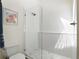 Modern bathroom shower with a glass door and tiled walls and floors at 1420 Defoors Nw Dr, Atlanta, GA 30318